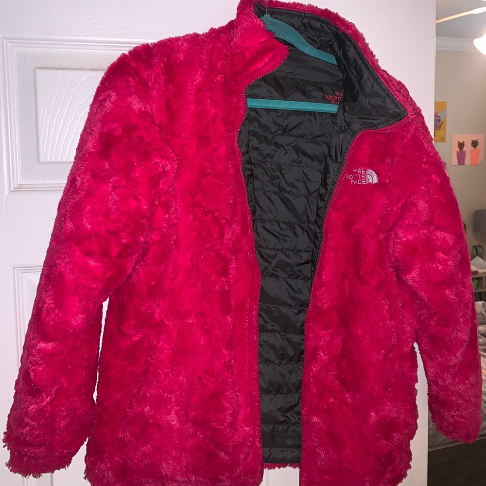 Kids North face size large/x-large reversible jacket.